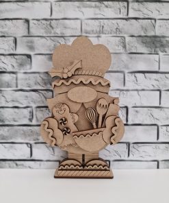 Gingerbread baking gnome standing on a base