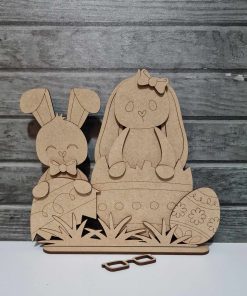 2 Bunny sitting in eggs on a base