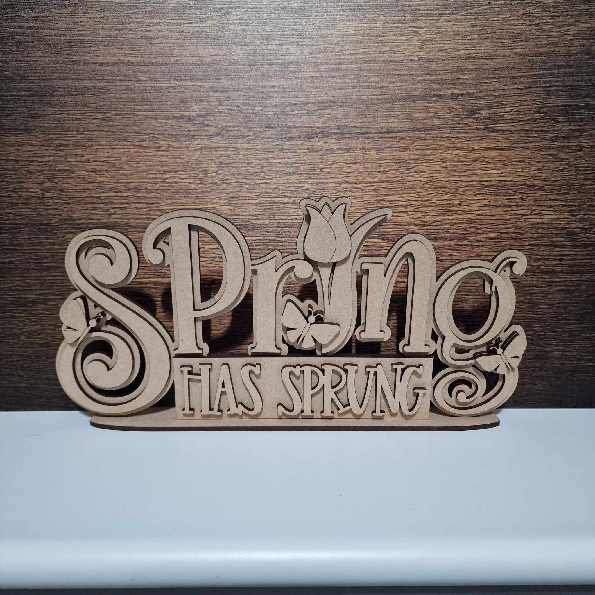 Spring has sprung plaque on base