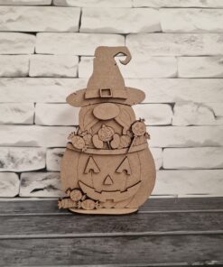 Witch in pumpkin with treats on base