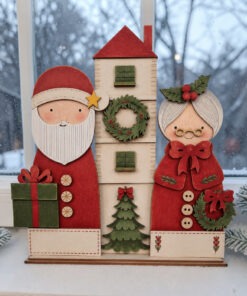 Santa with house & Mrs Claus on a base