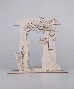 Wedding couple with floral arch