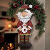 Tall Santa in pjs with snowman 25cm