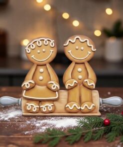 Pair of Gingerbreads sitting on Rolling Pin