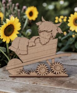 Alternative view of Highland in wheelbarrow with sunflowers